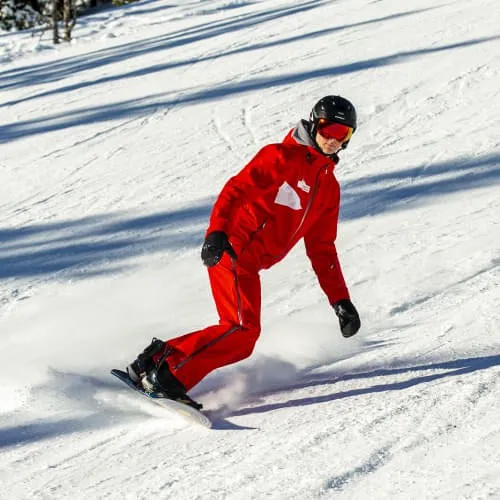 Person in red snowboard gear on snow