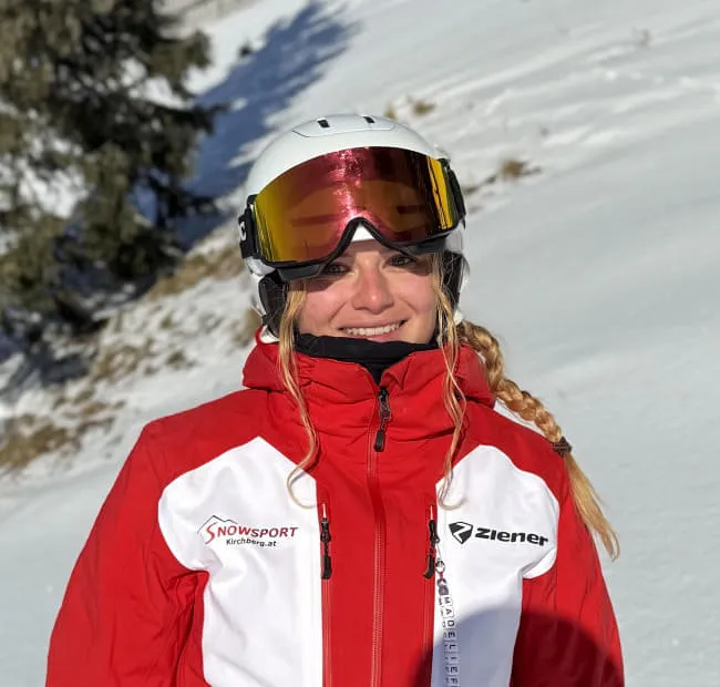 Person in ski gear on snow-covered slope