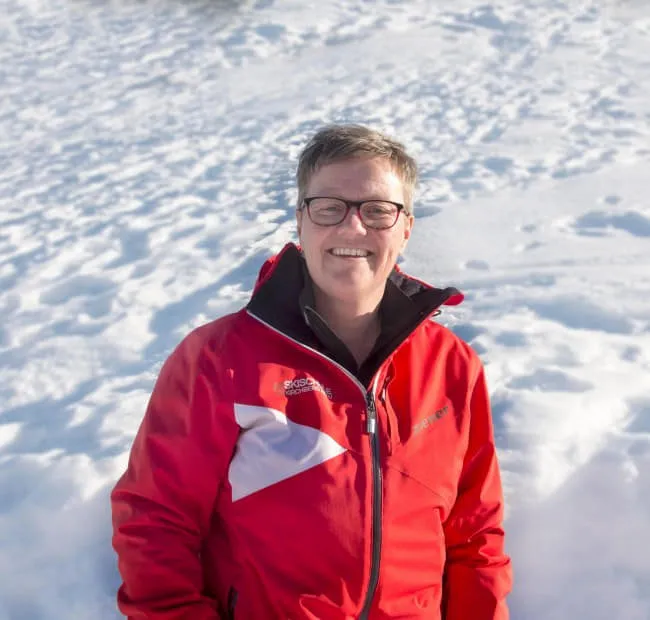Person in red jacket in a snowy landscape