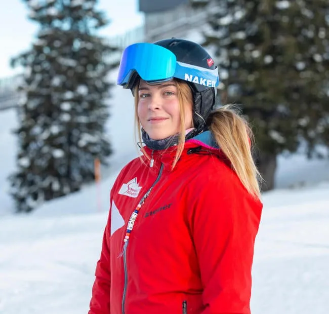 Skier in red jacket on the slopes