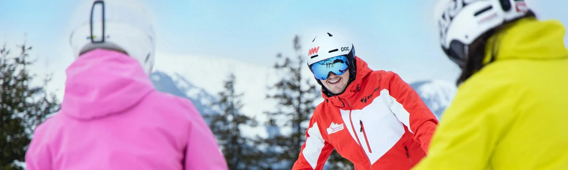 Skiers in Kirchberg with mountain scenery in background